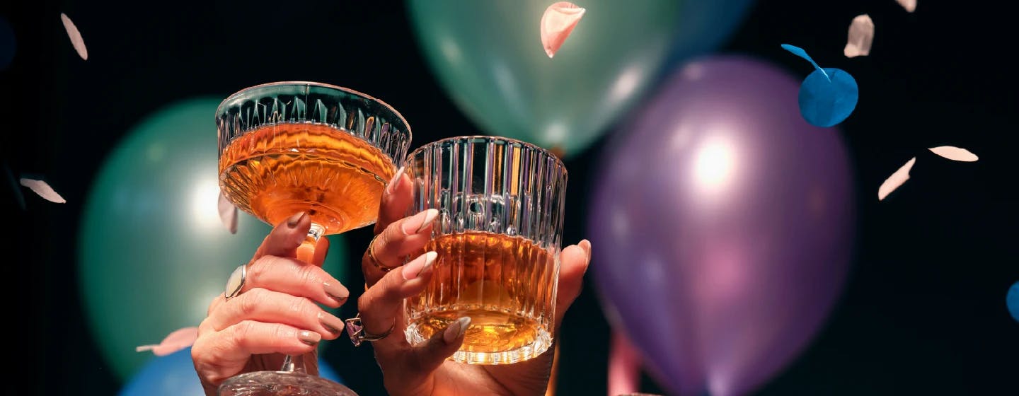people toasting drinks with balloons in the background, representing firefish group's shortlist in Market Research Society Awards 2019 best global agency category