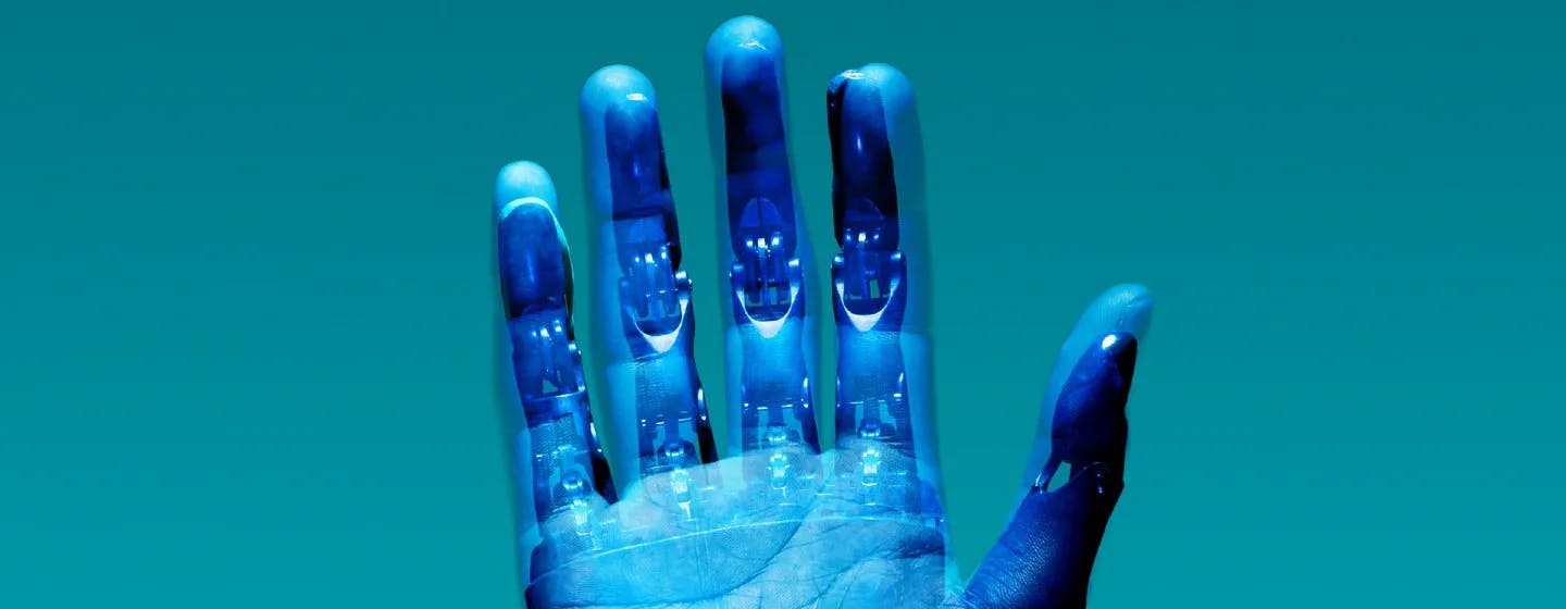 a robot hand overlaid with a human hand, representing the appointment of our head of innovation, richard owen
