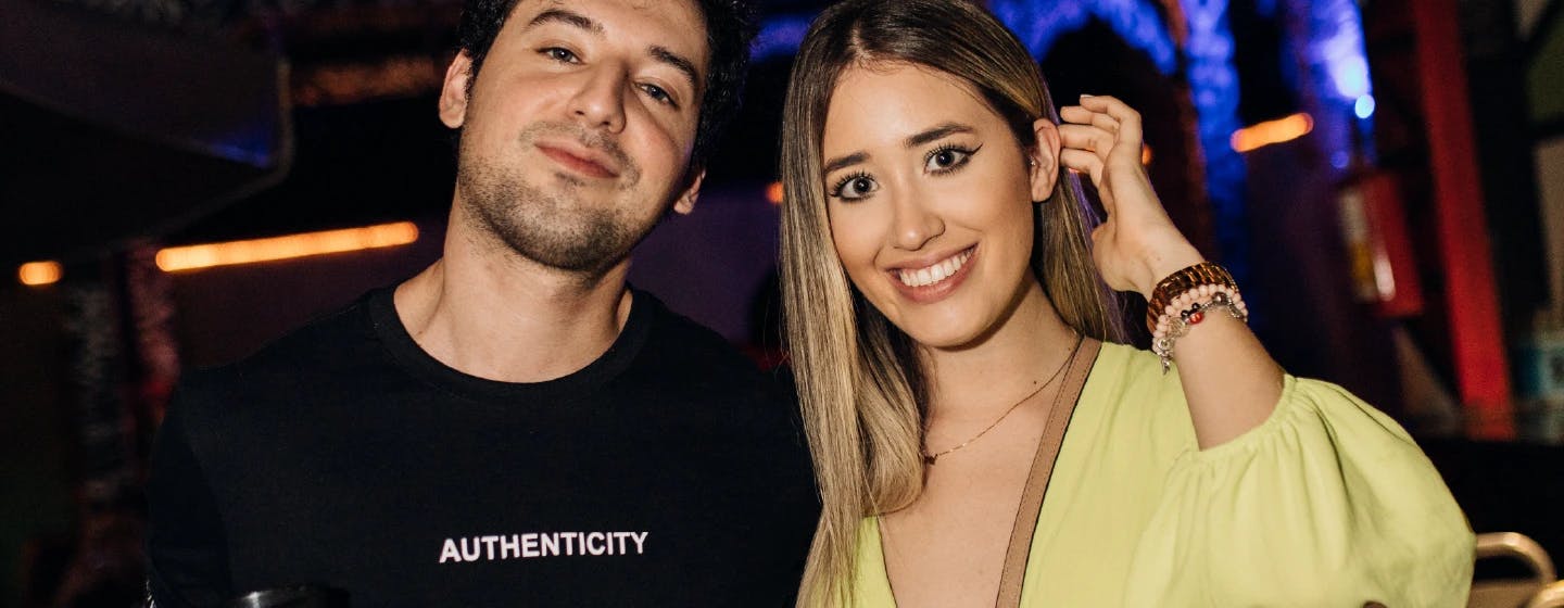 a couple where the man is wearing a t-shirt that says authenticity on it, representing how authenticity means something to people
