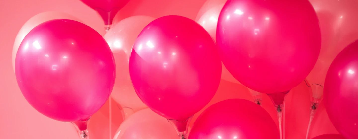 pink balloons representing the arrival of joella vera bril to the firefish uk team